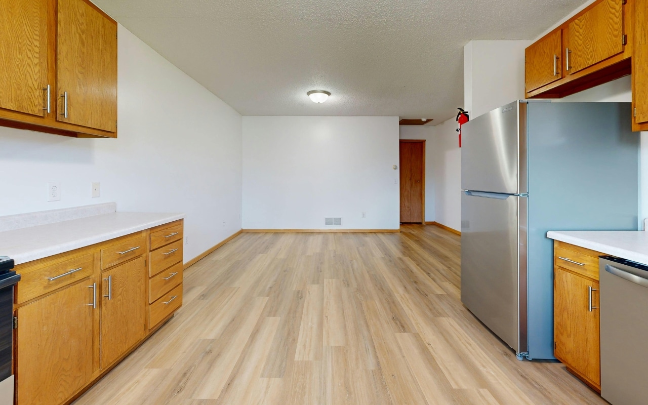 Luxury vinyl plank flooring installed in a modern kitchen showing wood look LVP floor construction and realistic plank texture