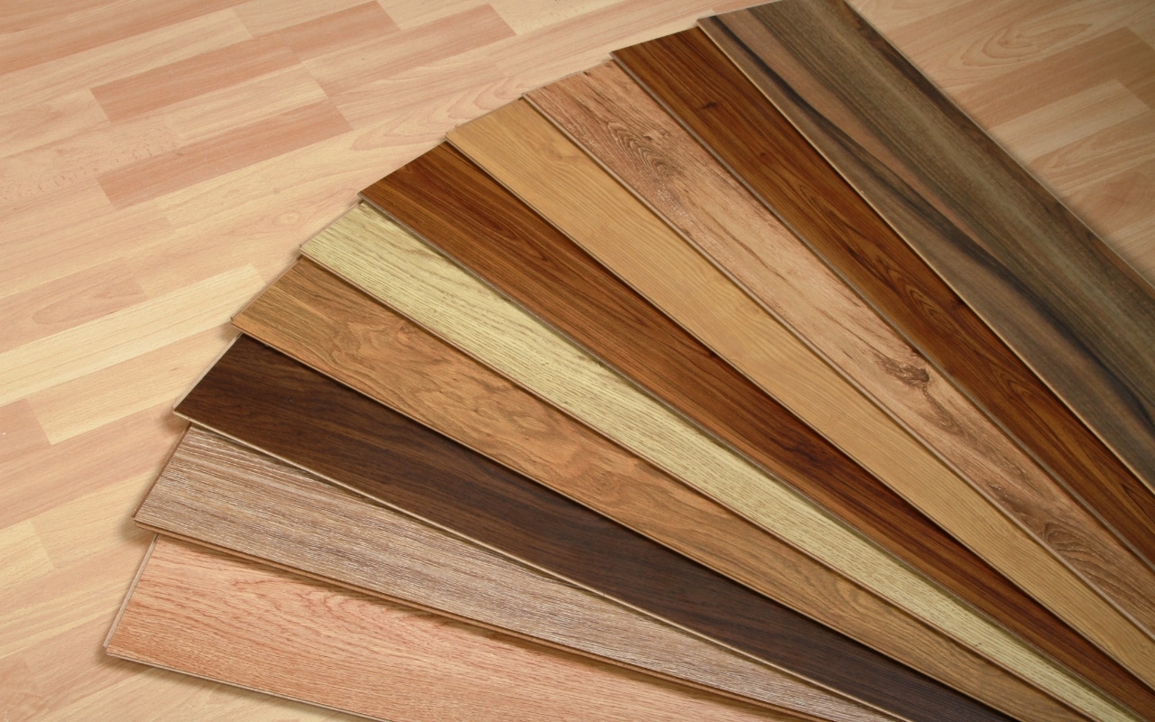 SPC vs WPC luxury vinyl plank flooring samples showing different plank core materials and wood look finishes
